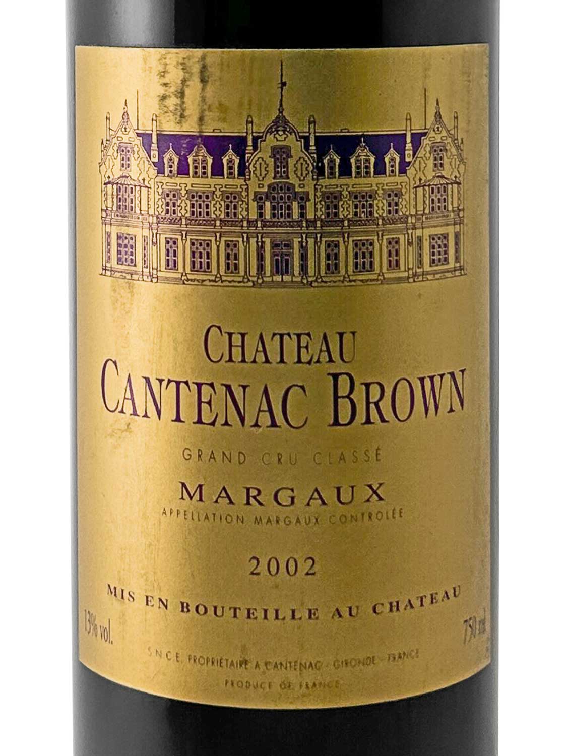 Goldfarbener Weinetikett mit violetter Zeichnung eines Schlosses, Text 'Chateau Cantenac Brown', 'Grand Cru Classé', 'Margaux', Jahrgang 2002, Flascheninhalt 75 cl, Alkoholgehalt 13 % vol.