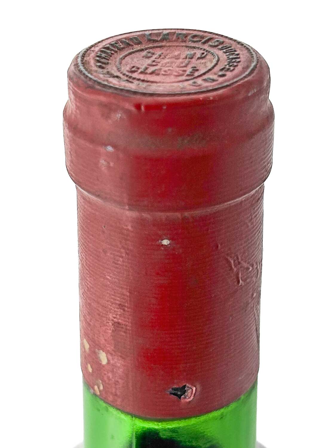 Flasche Château Larcis Ducasse 1976 mit rotem Kapselverschluss und geprägtem Siegel auf dem Kapselkopf