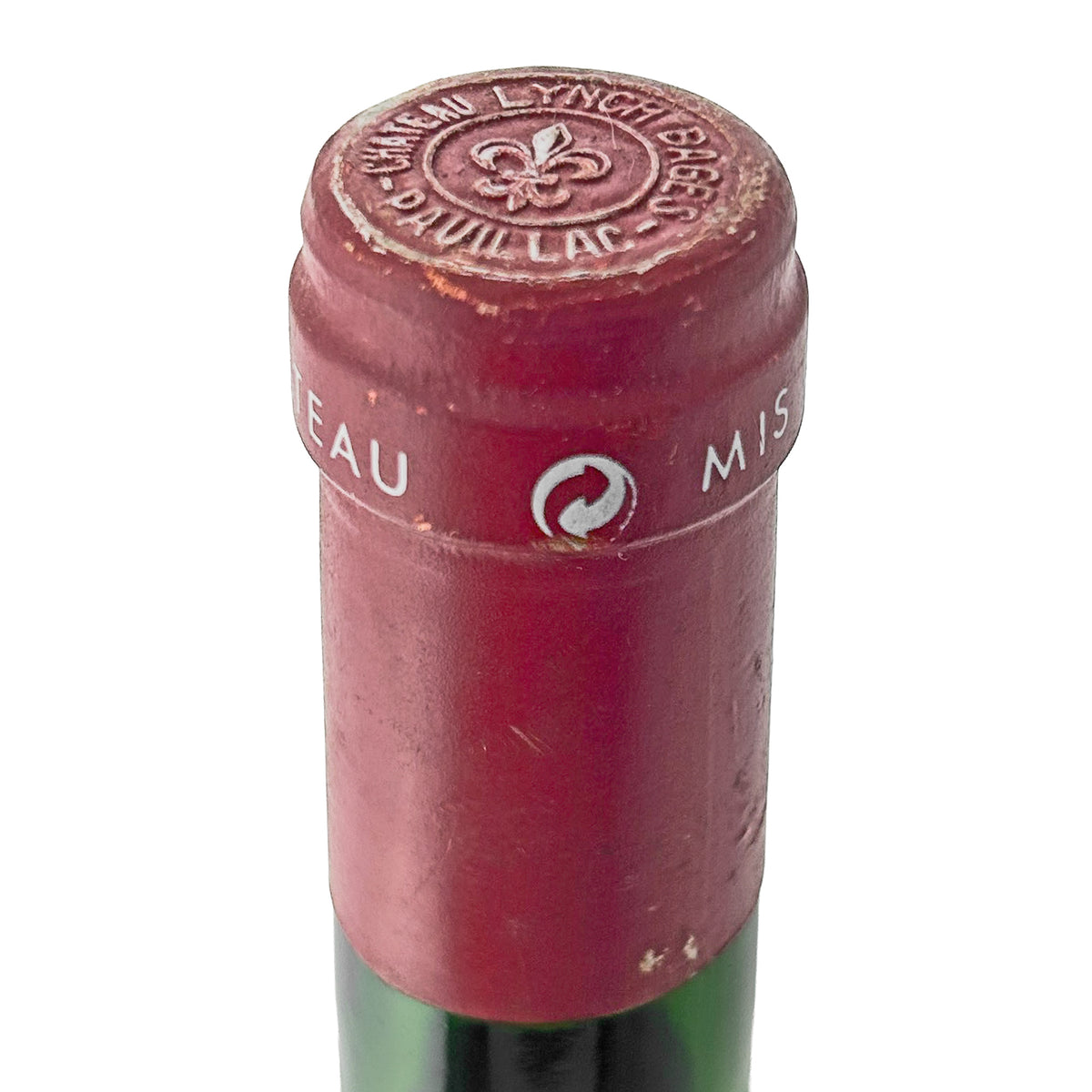 Château Lynch-Bages 1994 Kapsel in Nahaufnahme mit geprägter Lilie und Schriftzug Château Lynch Bages Pauillac