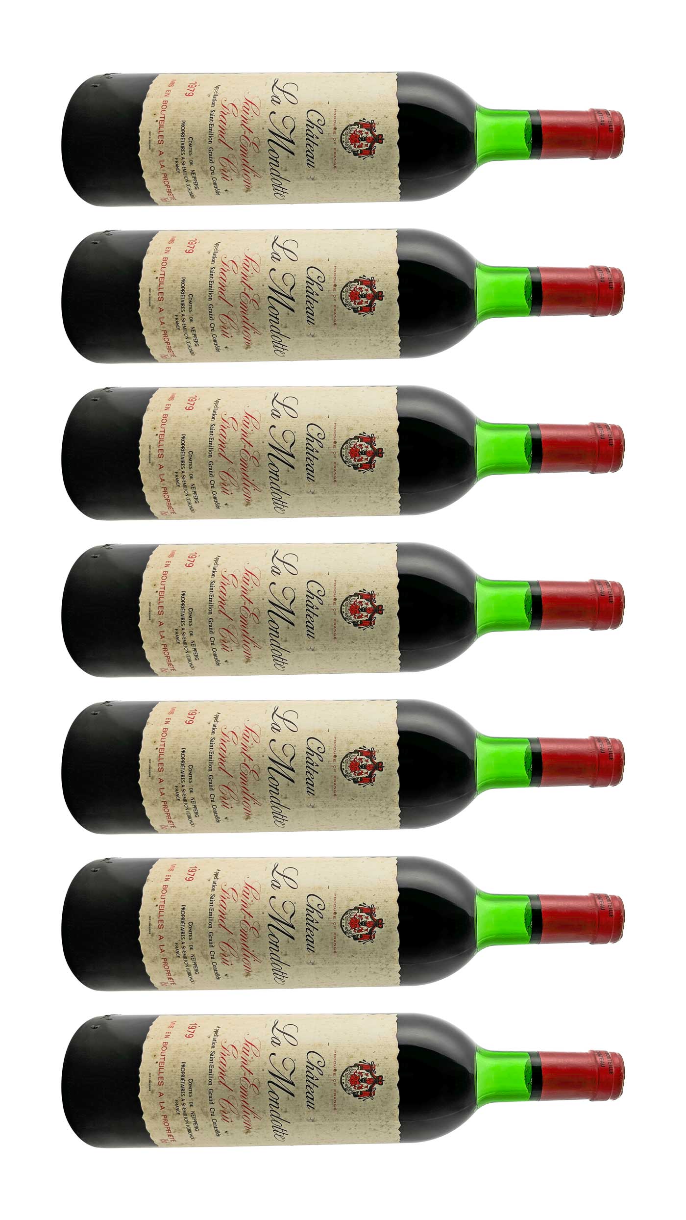 Sieben Flaschen Château la Mondotte Rotwein mit roten Kapseln und cremefarbenen Etiketten, übereinander angeordnet