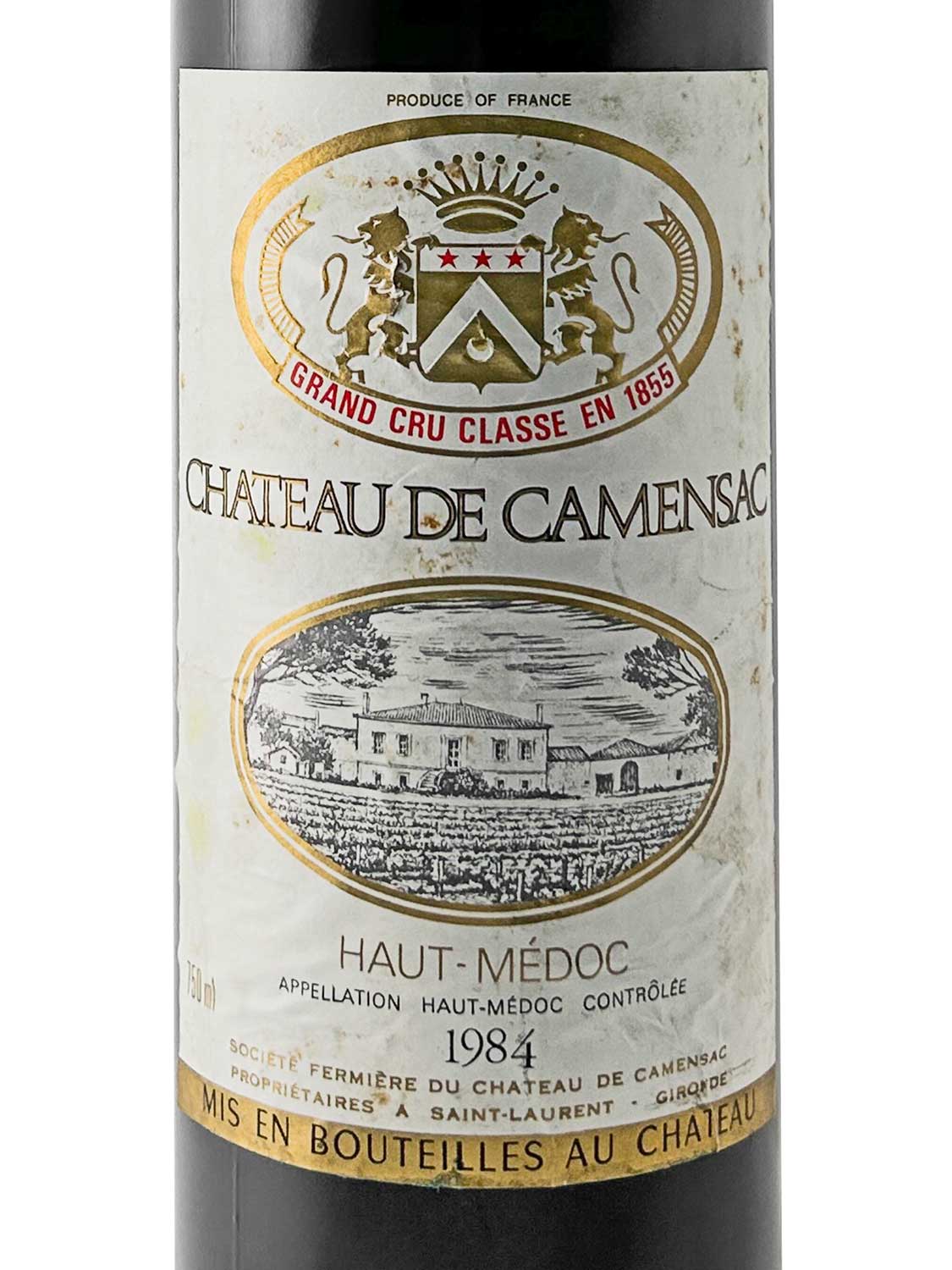 Weinflasche mit Etikett von Château de Camensac 1984, Grand Cru Classé, Haut-Médoc, mit Wappen und Illustration eines Weinguts.