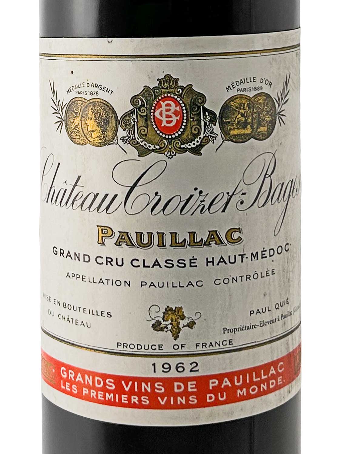 Weinflaschenetikett von Château Croizet-Bages 1962 mit Medaillenabbildungen, Schriftzug und rotem Balken am unteren Rand.