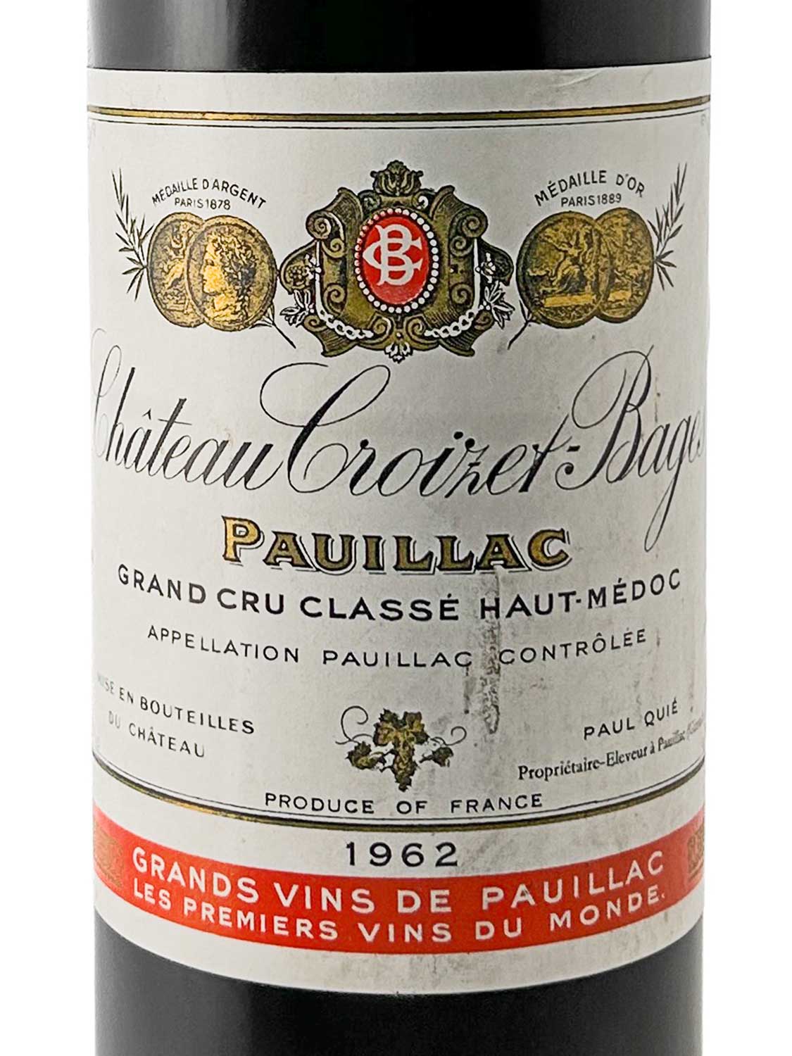 Weinetikett von Château Croizet-Bages 1962 mit goldenen Medaillen, dem Schriftzug 'Pauillac Grand Cru Classé Haut-Médoc', Jahrgang 1962 und rotem Balken mit der Aufschrift 'Grands Vins de Pauillac Les Premiers Vins du Monde'.