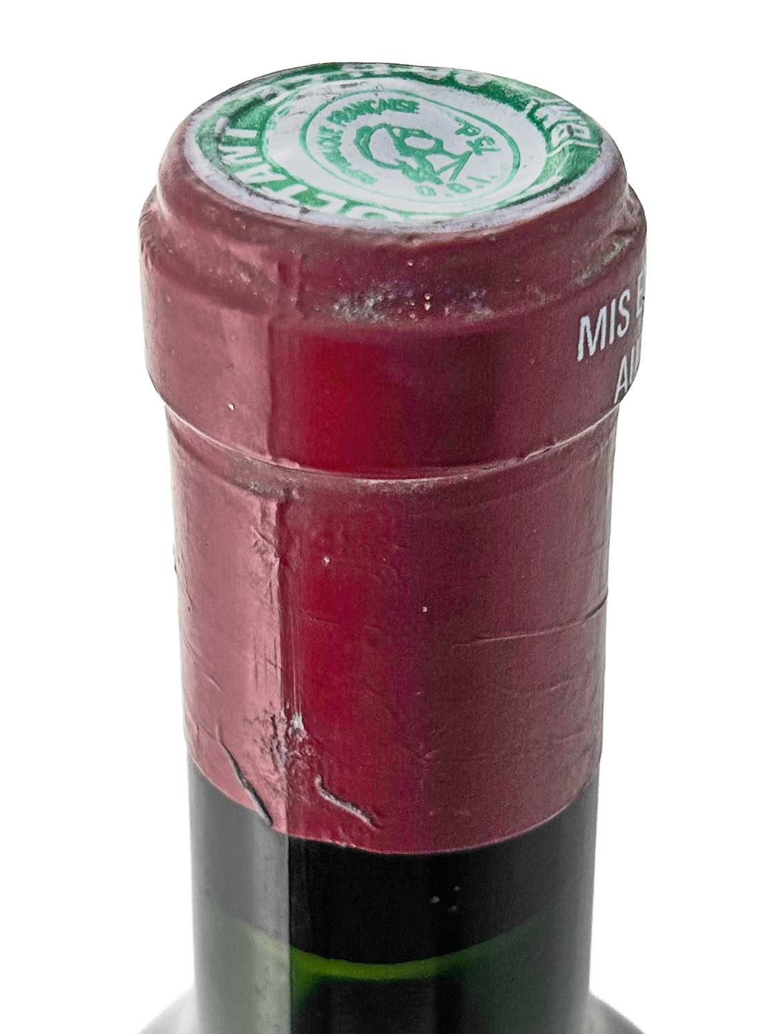 Flasche Château Croizet-Bages 1962 mit rotem Kapselverschluss und grün-weißem Siegel auf der Kapsel.