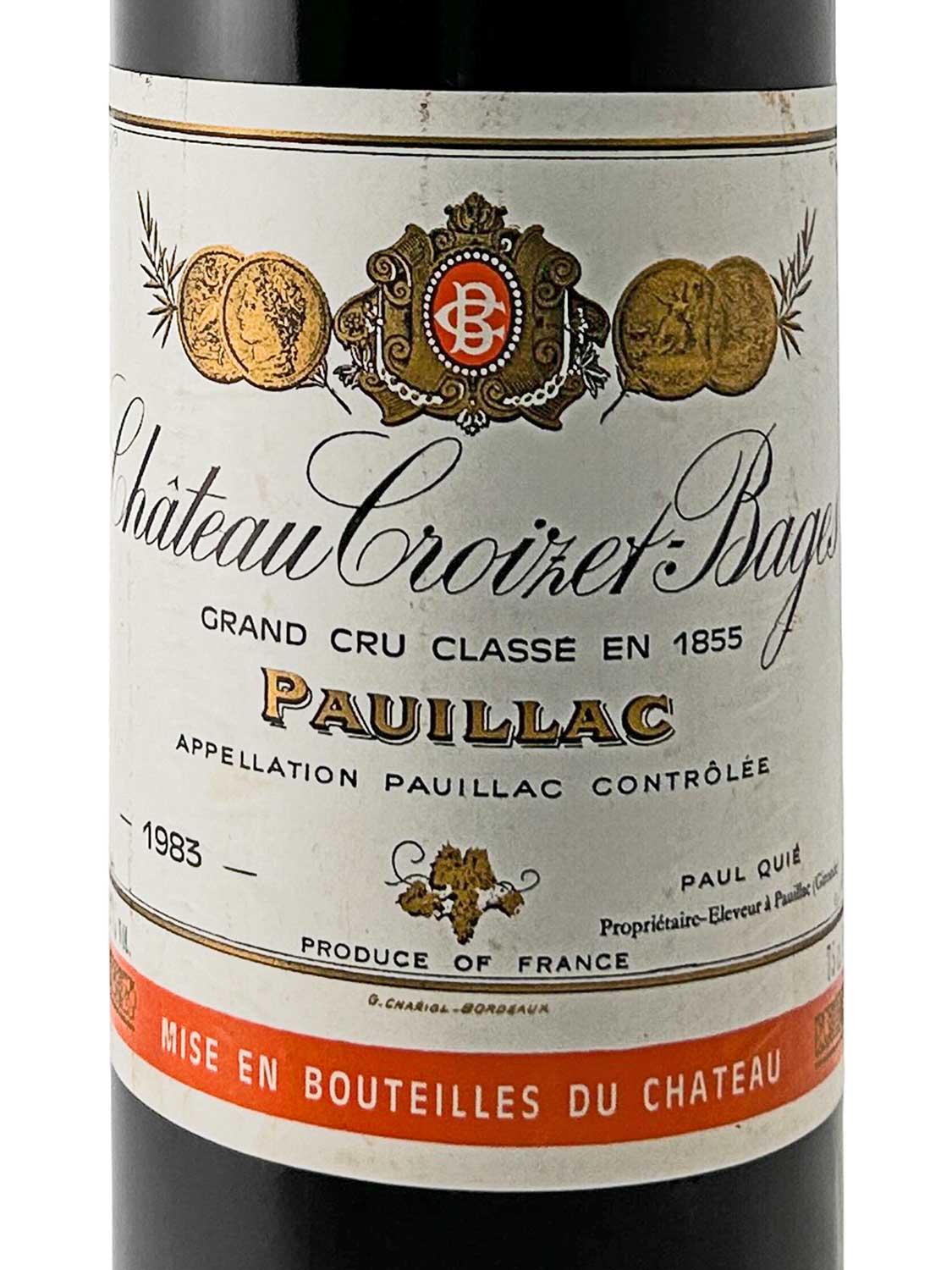 Weinflasche mit Etikett von Château Croizet-Bages 1983, Grand Cru Classé, Pauillac, mit goldenen Medaillen und rotem Streifen am unteren Rand.