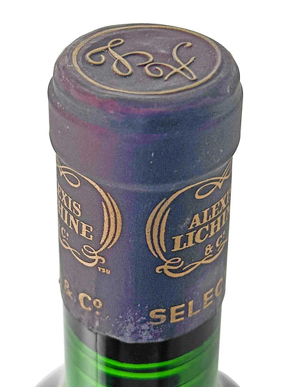 Flaschenkapsel mit goldener Schrift 'ALEXIS LICHTINE & Co' und dekorativem Monogramm auf der Oberseite.