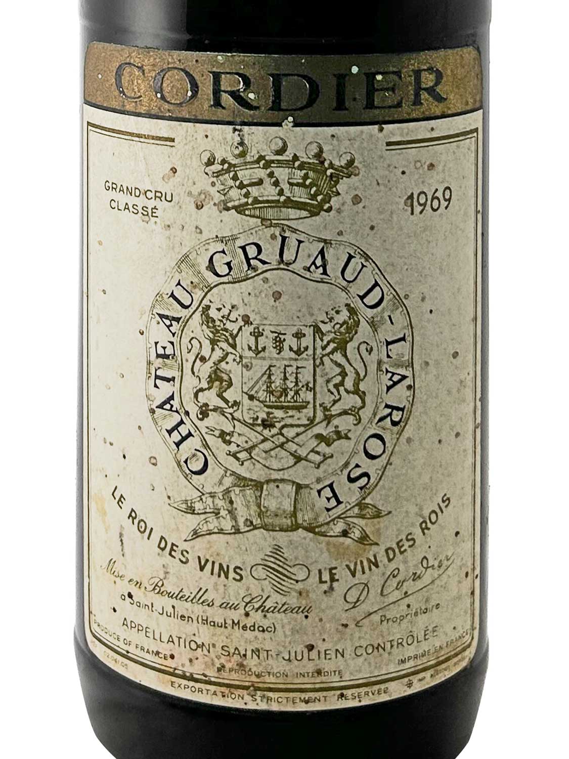 Weinflasche mit einem Etikett von Château Gruaud-Larose 1969, das ein Wappen mit zwei Löwen und eine Krone zeigt.