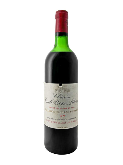 Grüne Weinflasche mit rotem Kapselverschluss, Etikett mit Text 'Château Haut Bages Libéral', Jahrgang 1975, Grand Cru Classé, Pauillac.