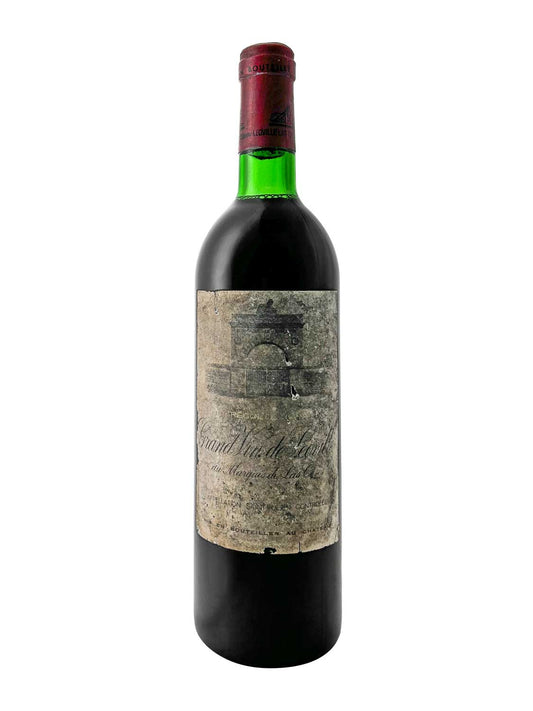 Flasche Château Léoville las Cases 1978 mit grünem Hals, rotem Verschluss und gealtertem Etikett mit verblasster Schrift und Abbildung eines Gebäudes