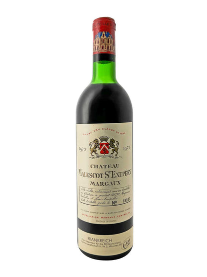 Grüne Weinflasche mit rotem Kapselverschluss, Etikett mit Wappen und Text 'CHATEAU MALESCOT St EXUPÉRY MARGAUX 1973', Jahrgang 1973, französischer Rotwein.