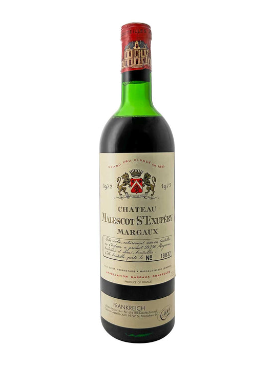 Grüne Weinflasche mit rotem Verschluss und Etikett mit Wappen und der Aufschrift 'Chateau Malescot St Exupery Margaux 1973'