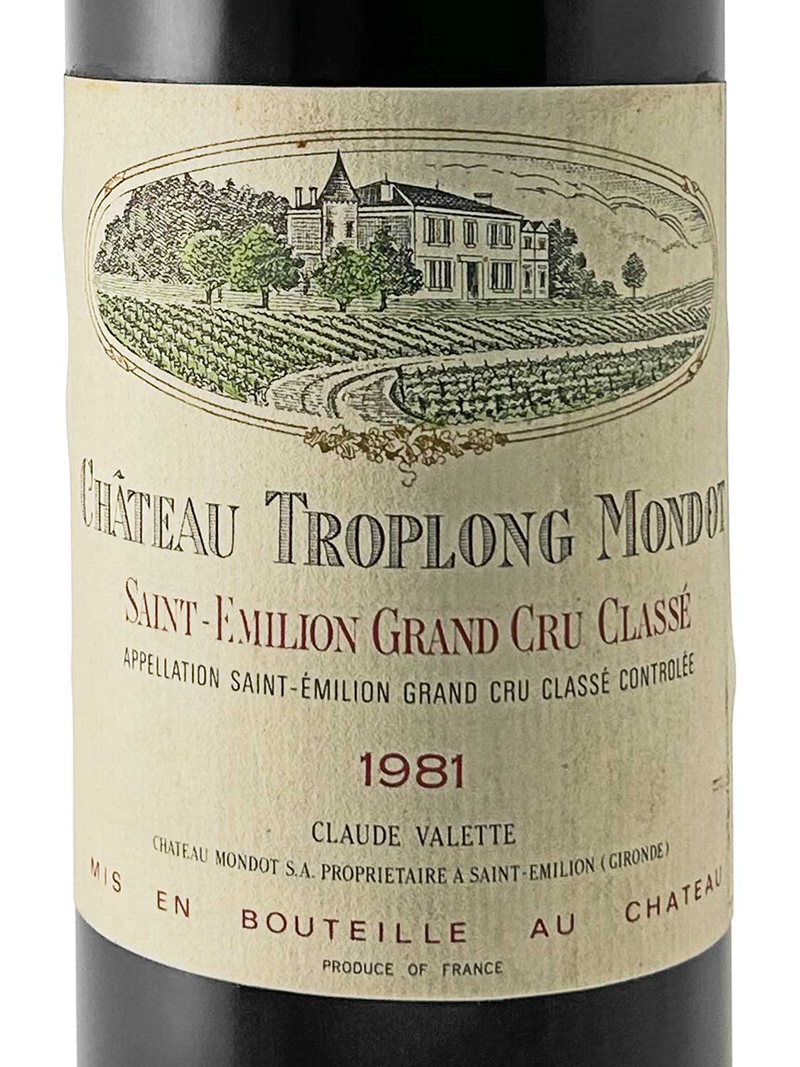 Weinflasche mit Etikett von Château Troplong Mondot, Saint-Émilion Grand Cru Classé, Jahrgang 1981. Auf dem Etikett ist eine Abbildung des Weinguts und der Text 'Claude Valette' sowie 'MIS EN BOUTEILLE AU CHÂTEAU'.